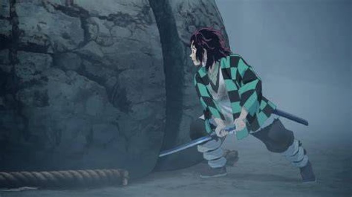Does Tanjiro slice the boulder?
