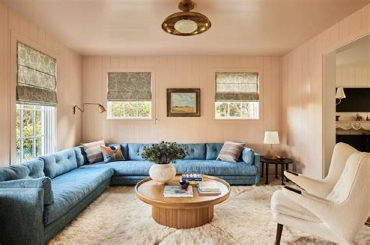What color furniture makes room bigger?