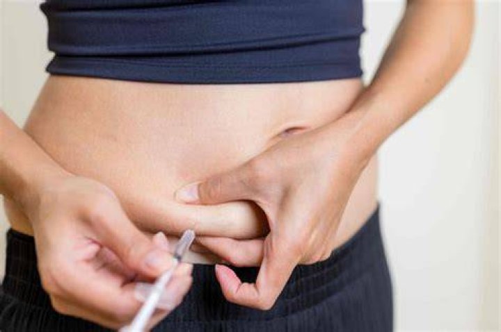 Why do people inject 2 inches out of their belly button?